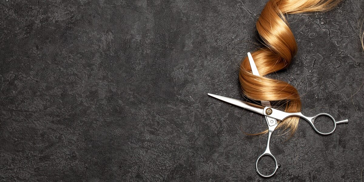 The hairdresser. Scissors and curl of hair on a black background. Schlagwort(e): hairdresser, beauty, salon, barber, scissor, hair, fashion, professional, haircut, style, equipment, cut, hairstyle, hairdressing, stylist, black, tool, modern, cutting, styling, object, haircutting, brown, care