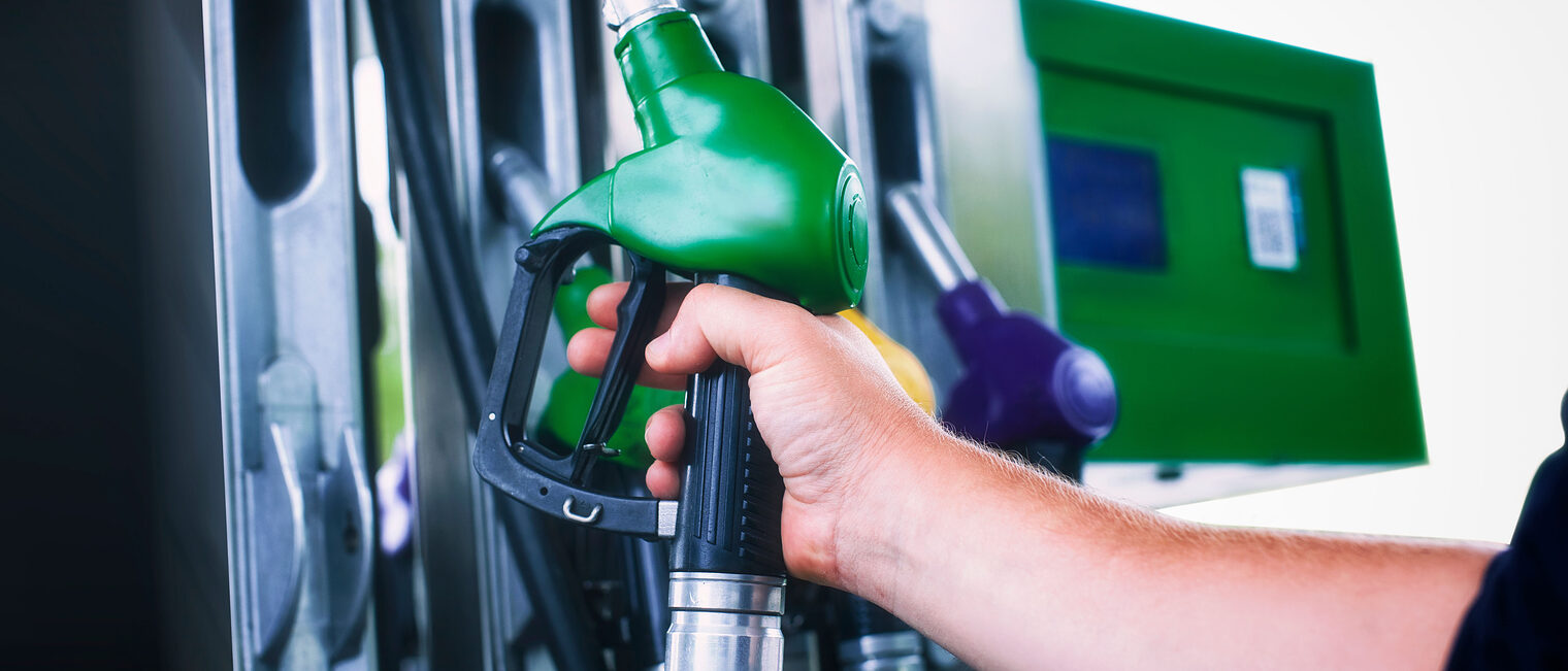 Man holds a refueling gun in his hand for refueling cars. Gas station with diesel and gasoline fuel close-up Schlagwort(e): station, gas, close, up, hand, people, pumping, gasoline, gun, fuel, car, petrol, background, pump, service, oil, energy, blue, industry, petroleum, close-up, transport, diesel, man, guy, hold, vehicle, refuel, benzine, sign, power, transportation, refueling, gallon, colorful, price, symbol, cost, isolated, economy, barrel, fueling, green, pollution, environment, automotive, shop, truck, auto, eco