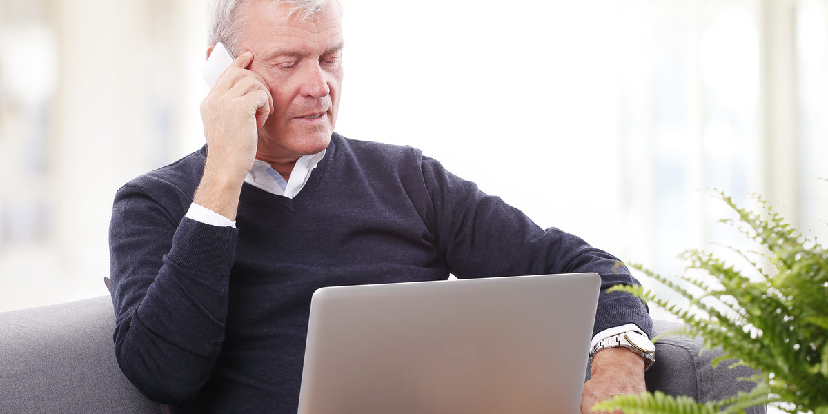Portrait of busy senior businessman holding in hand a mobile phone and making call while working online on laptop. Schlagwort(e): Business, Old, Senior, Computer, Laptop, Sofa, Looking At Camera, Retired, Retirement, Men, Working, Mobile Phone, Handy, Telephone, Conversation, Talking, Consulting, Discussing, Active, Retired, Retirement, Professional Occupation, Portrait, Close-up, Sitting, Executive, Expertise, Casual, Manager, Confident, Internet, Business People, Sales, Director, Managing, 60s, 70s, business, old, senior, computer, laptop, sofa, looking at camera, retired, retirement, men, working, mobile phone, handy, telephone, conversation, talking, consulting, discussing, active, professional occupation, portrait, close-up, sitting, executive, expertise, casual, manager, confident, internet, business people, sales, director, managing, 60s, 70s